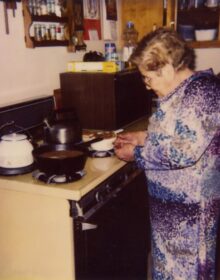 Grama Jesusita in front of stove making Mexican food