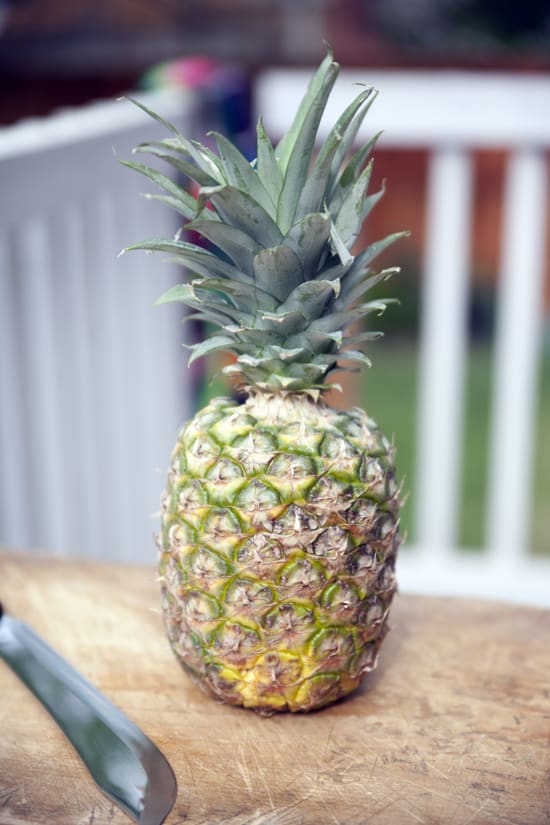 pineapple and knife - How to Select and Cut a Pineapple