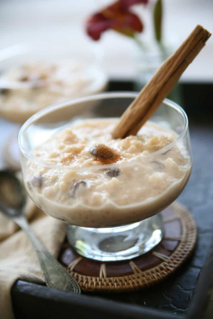 arroz con leche (Mexican rice pudding) recipe after being dished out into coupe glasses and garnished with a cinnamon stick