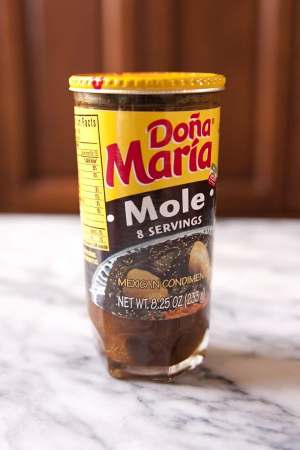 jar of doña maria mole paste on a marble table
