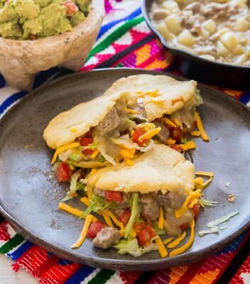 mexican gorditas on a grey plate.