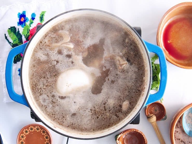 boiling pot with beef and onion to make beef soup