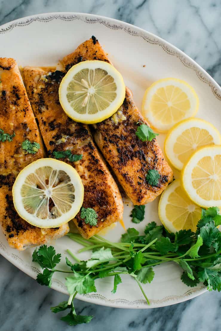 Lemon Butter Fish served with lemons and herbs