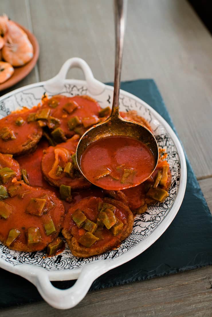 Tortitas de Camarón red chile sauce nopales in a ladle