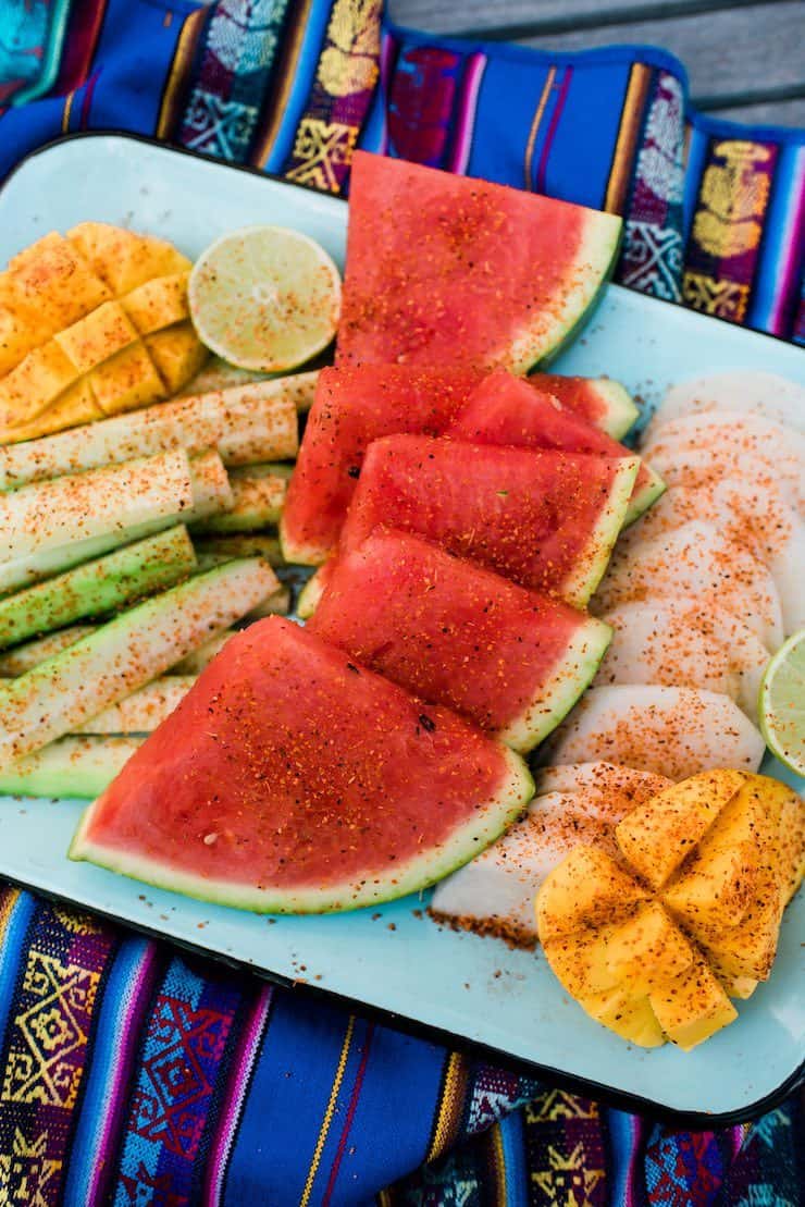 mango, cucumber, watermelon, jicama platter arrangement with chili powder
