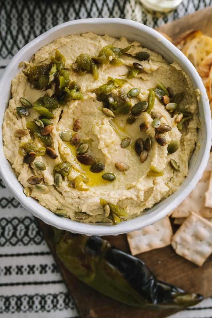 Spicy Roasted Green Chile Hummus made with Hatch Chile and sprinkled with pipits
