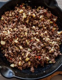 cast iron skillet filled with mexican picadillo