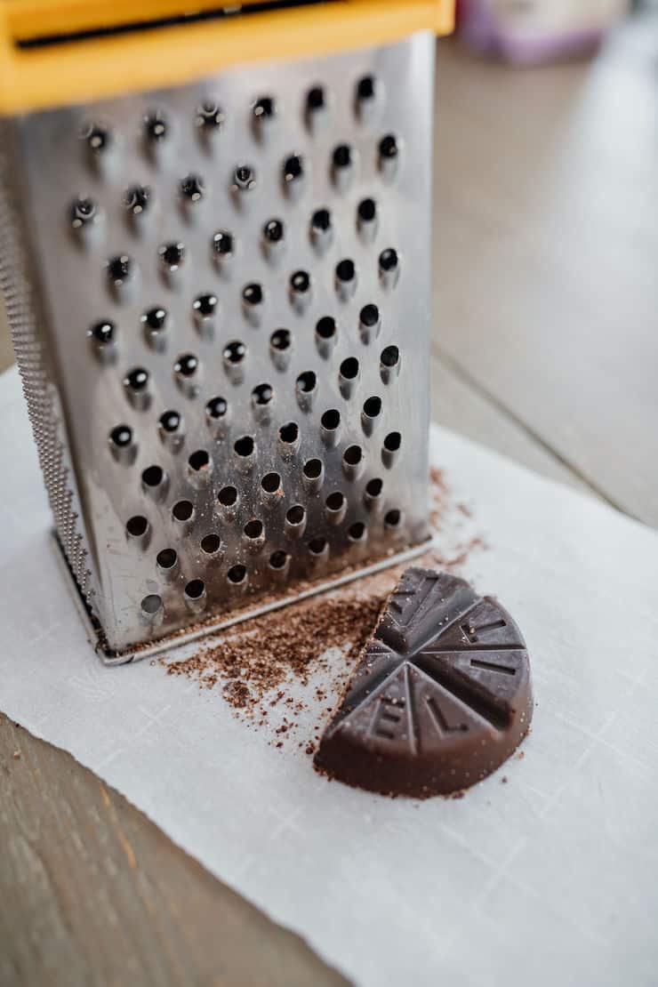 box grater with grated piece of mexican chocolate