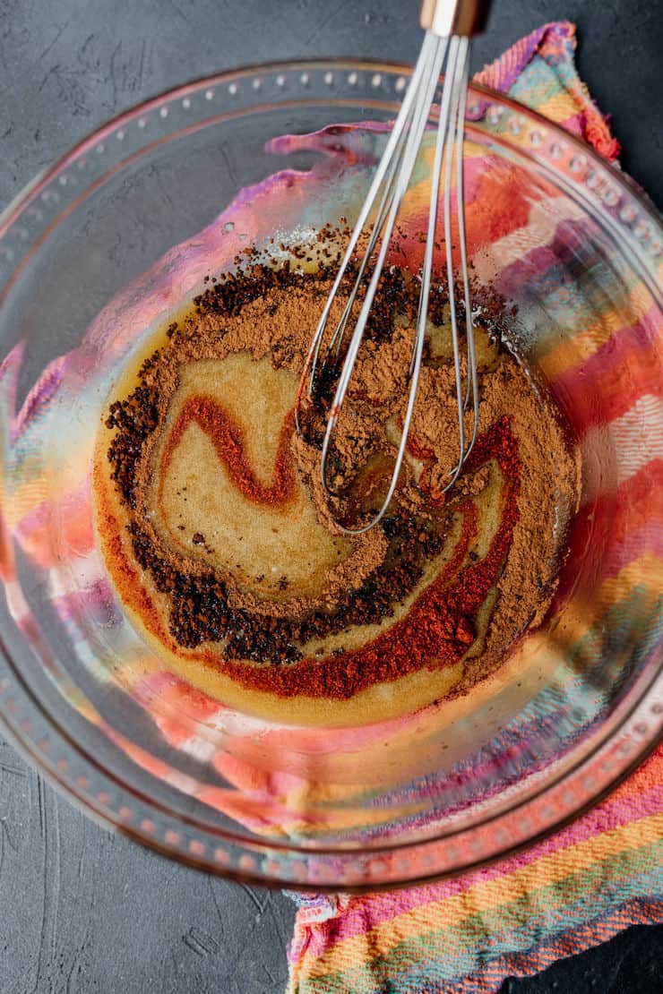 mixture of eggs and spices to make Mexican chocolate brownies on a colorful linen