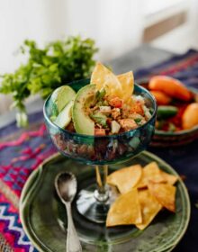 canned salmon salad ceviche style served in a glass with avocado slices and tortilla chips