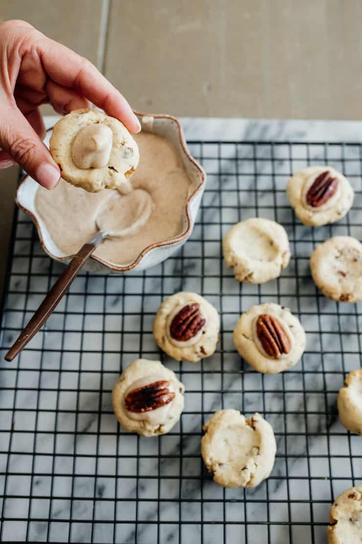 Double Pecan Thumbprint cookies with a caramel icing on top
