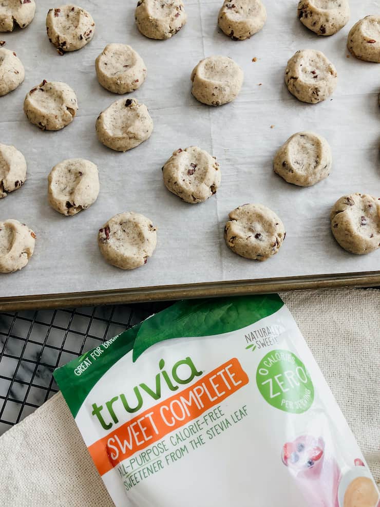 baking sheet of Double Pecan Thumbprint cookies with Truvia sweet complete below