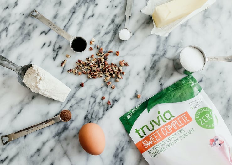 ingredients on a marble countertop to make Double Pecan Thumbprints with Truvia sweet complete
