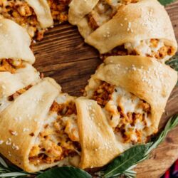 easy christmas breakfast crescent wreath on a wooden platter