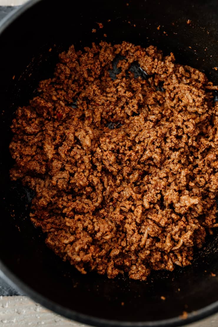 chorizo and ground beef mix browning in a dutch oven for chili con carne