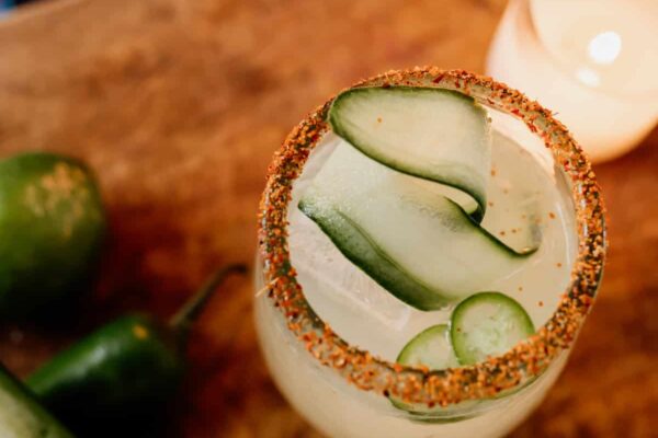 spicy cucumber margarita top down with a ribbon of cucumber