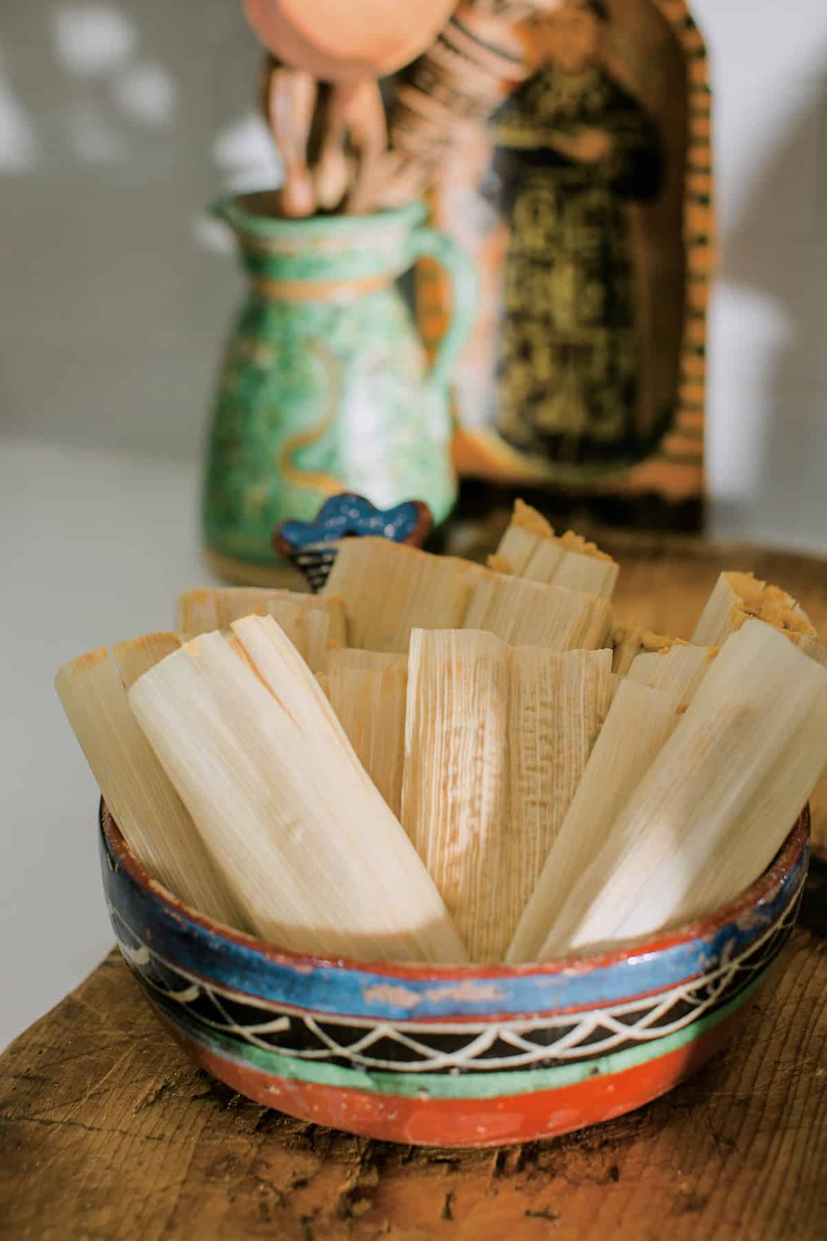 a Mexican vintage bowl filled with prepared pumpkin spice tamales