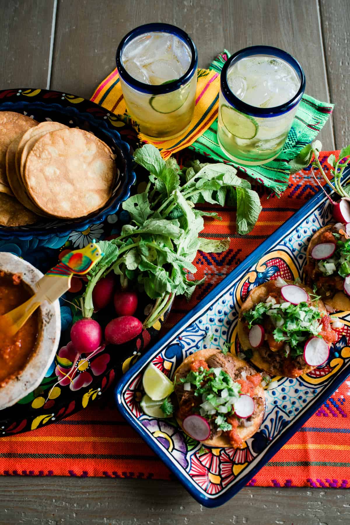 slow cooked lengua recipe served as tostadas de lengua on Mexican pottery traditional Mexican dish with margaritas and Chile de Arbol Salsa 
