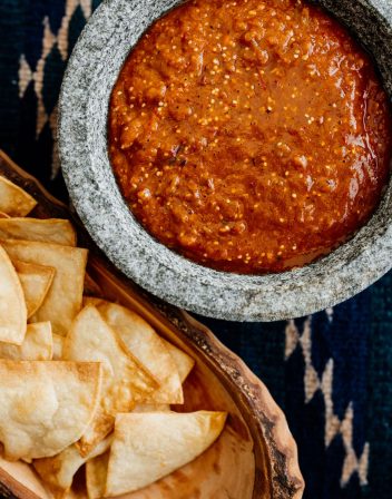 a bowl of this Roasted Tomatillo-Chipotle Salsa served with tortilla chips