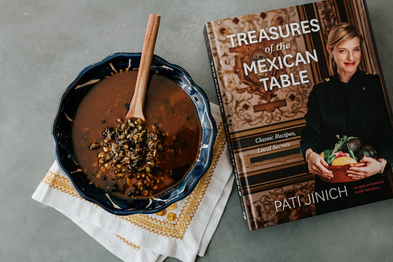 bowl of salsa macha next to pati jinich's book, Treasures of the Mexican Table.