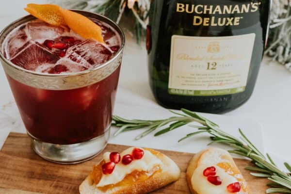 pomegranate whisky sour with a brie and pomegranate crostini.