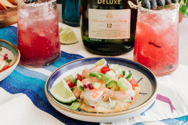 blueberry whisky margaritas with a plate of ceviche tostadas.