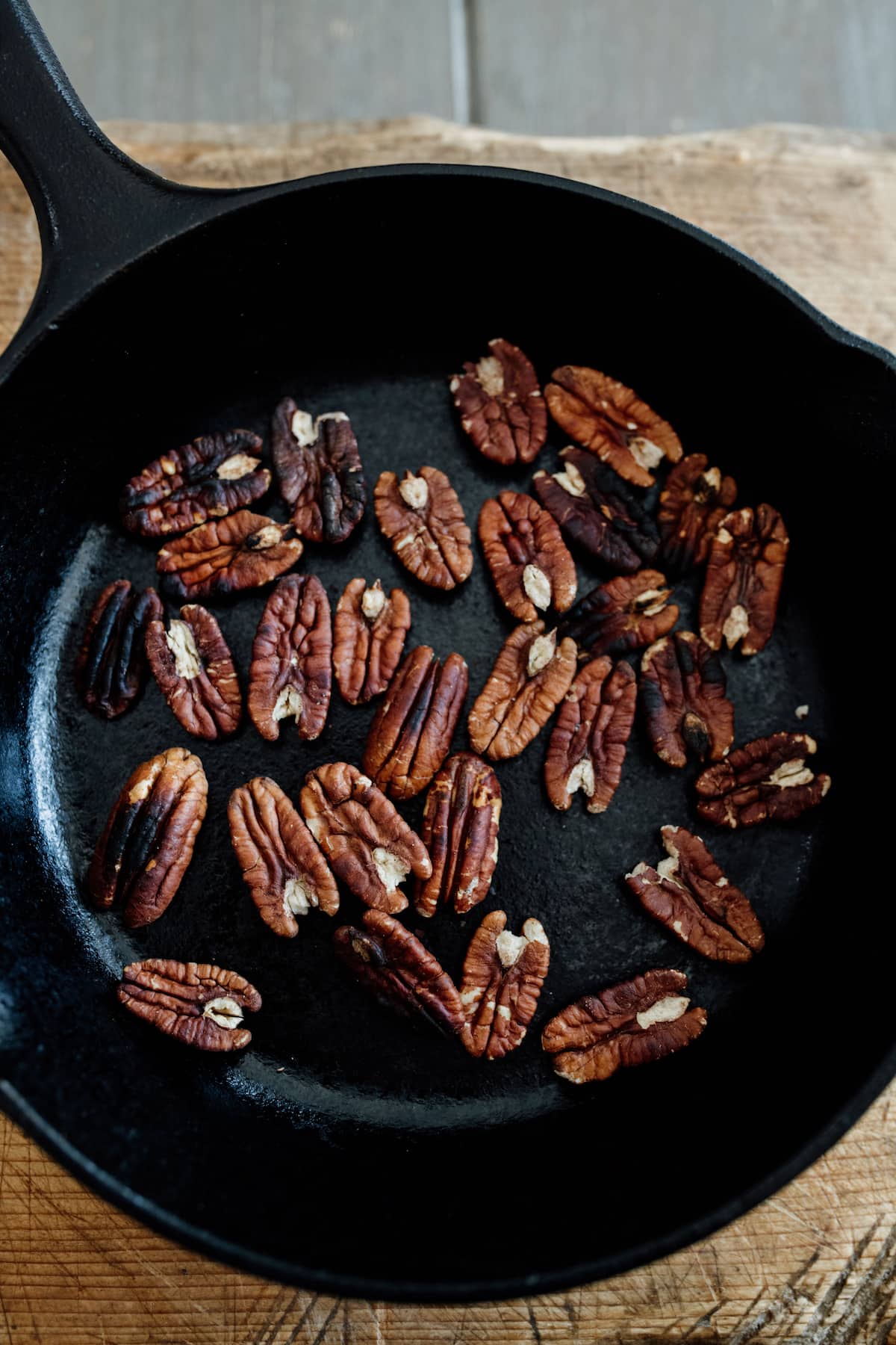 toasting pecans in a cast-iron skillet.