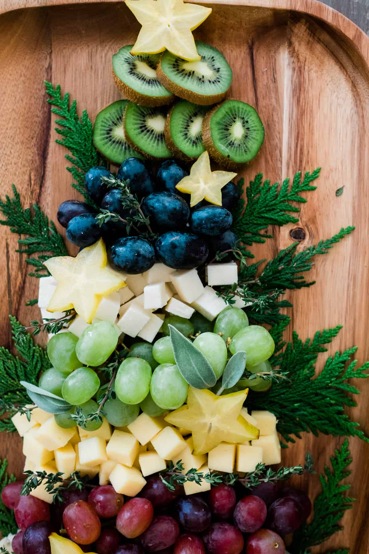 Christmas Tree Cheese Board star fruit at top. 